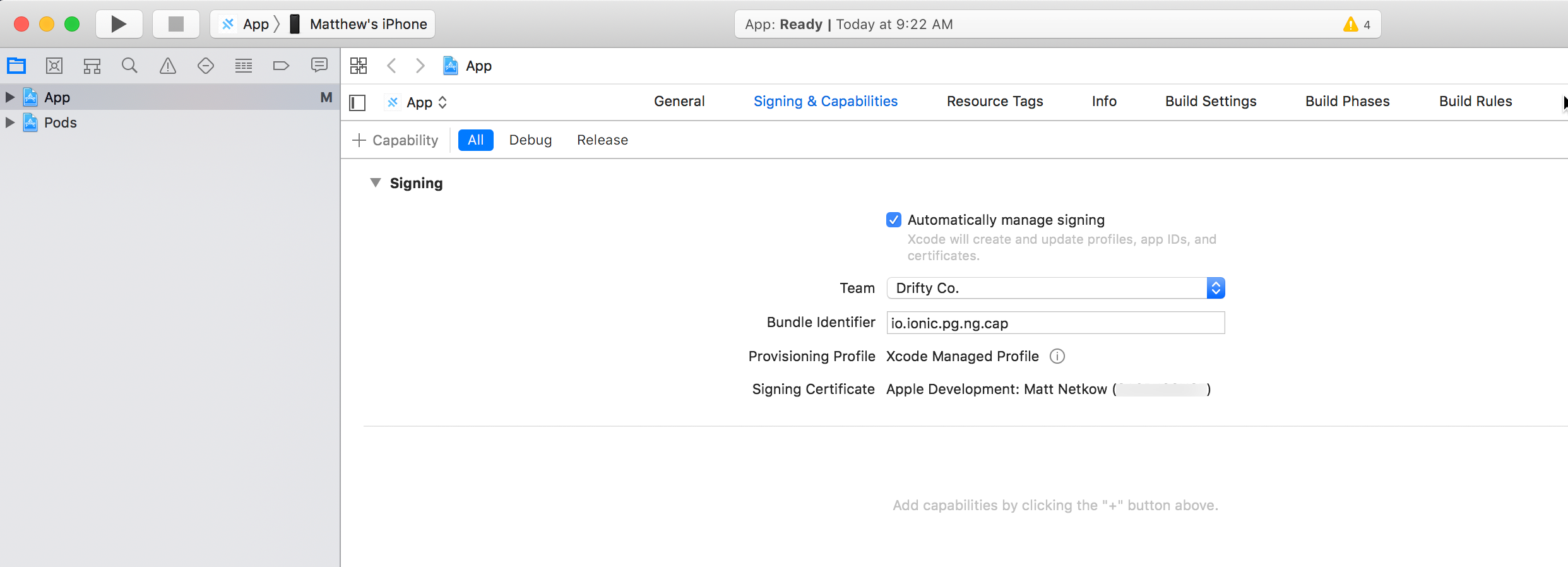 Xcode Signing & Capabilities The Xcode interface displaying the Signing and Capabilities tab for an iOS app project.